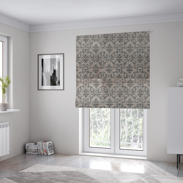 The fabric used to create these Roman blinds is featuring a repeating traditional damask pattern in white and dark grey outlines over a textured, light taupe background.