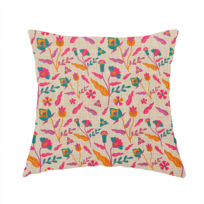 The fabric used to create this handmade cushion is featuring a vibrant, repeating floral pattern with pink, orange, and teal blossoms and leaves on a neutral, linen-textured beige background.