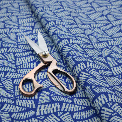 Fabric featuring a vibrant, repeating geometric pattern of light grey, abstract leaf or comb-like blocks closely packed on a royal blue background.