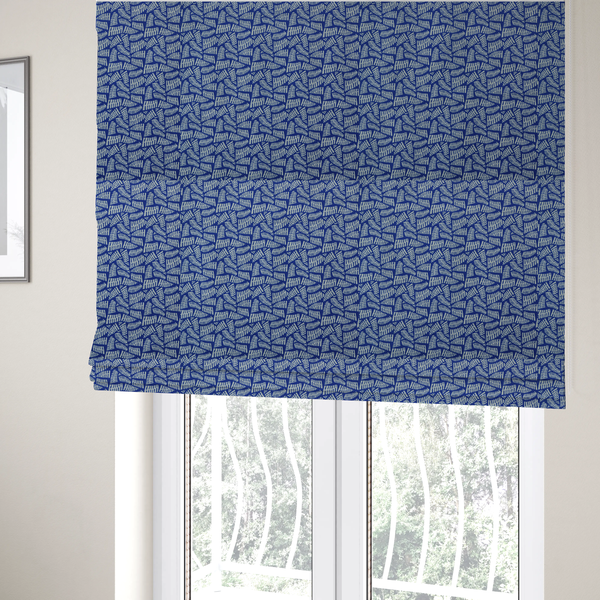 The fabric used to create these Roman blinds is featuring a vibrant, repeating geometric pattern of light grey, abstract leaf or comb-like blocks closely packed on a royal blue background.