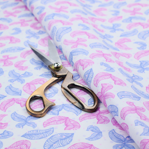 Fabric featuring a repeating pattern of sketched, line-art leaves and butterflies in pastel pink and light blue on a pale grey background.