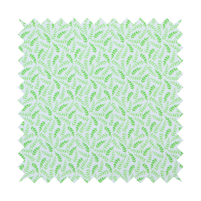 Fabric featuring a dense, repeating pattern of small, vibrant lime green leafy sprigs and fern-like fronds on a crisp white background.