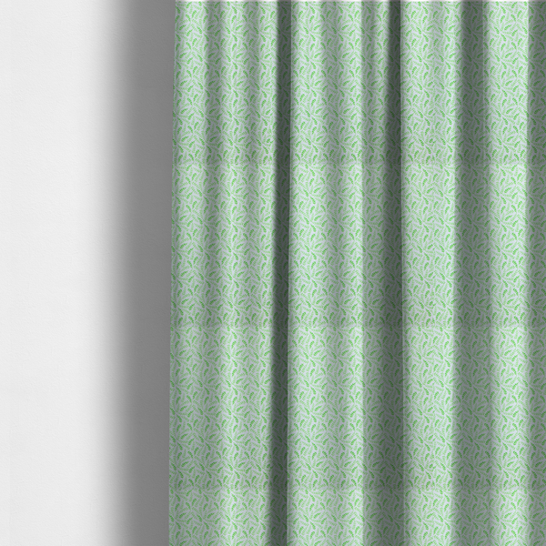 The fabric used to create these made-to-measure curtains is featuring a dense, repeating pattern of small, vibrant lime green leafy sprigs and fern-like fronds on a crisp white background.