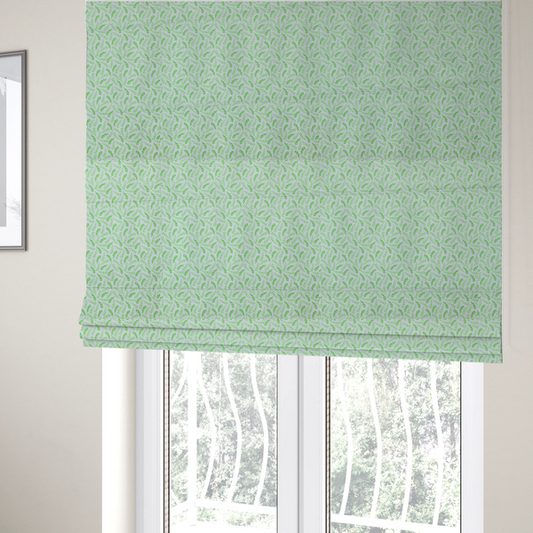 The fabric used to create these Roman blinds is featuring a dense, repeating pattern of small, vibrant lime green leafy sprigs and fern-like fronds on a crisp white background.