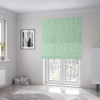 The fabric used to create these Roman blinds is featuring a dense, repeating pattern of small, vibrant lime green leafy sprigs and fern-like fronds on a crisp white background.