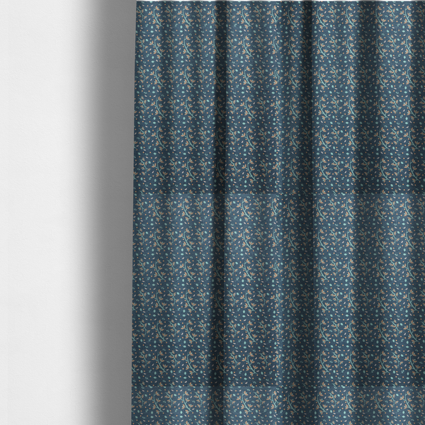 The fabric used to create these made-to-measure curtains is a slate blue textured fabric with a delicate ditsy botanical print. The repeating pattern features thin, curved mint green vine stems with small peach-coloured leaves, surrounded by tiny scattered peach polka dots and miniature teal leaf accents throughout the design.