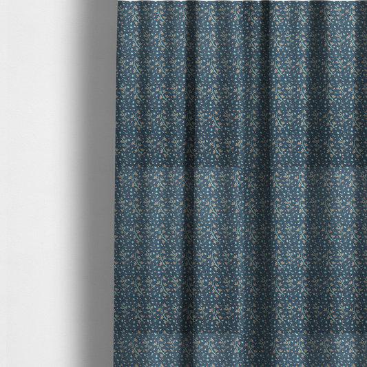 The fabric used to create these made-to-measure curtains is a slate blue textured fabric with a delicate ditsy botanical print. The repeating pattern features thin, curved mint green vine stems with small peach-coloured leaves, surrounded by tiny scattered peach polka dots and miniature teal leaf accents throughout the design.