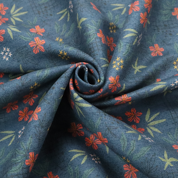 Deep teal blue fabric featuring a subtle crosshatch texture and a tropical botanical print. The repeating pattern showcases clusters of small rust-coral flowers, sage green palm fronds, and scattered miniature yellow starburst blooms.