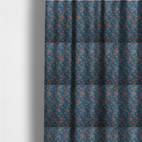 The fabric used to create these made-to-measure curtains is a deep teal blue fabric featuring a subtle crosshatch texture and a tropical botanical print. The repeating pattern showcases clusters of small rust-coral flowers, sage green palm fronds, and scattered miniature yellow starburst blooms.