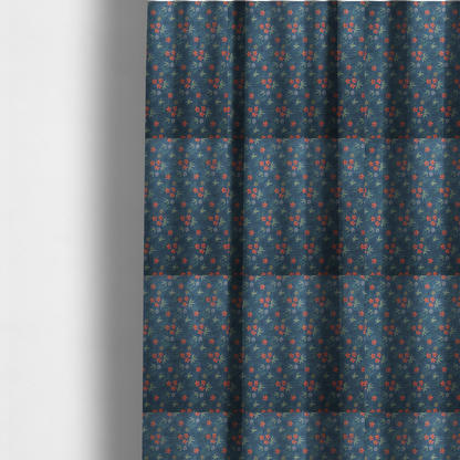 The fabric used to create these made-to-measure curtains is a deep teal blue fabric featuring a subtle crosshatch texture and a tropical botanical print. The repeating pattern showcases clusters of small rust-coral flowers, sage green palm fronds, and scattered miniature yellow starburst blooms.