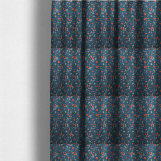 The fabric used to create these made-to-measure curtains is a deep teal blue fabric featuring a subtle crosshatch texture and a tropical botanical print. The repeating pattern showcases clusters of small rust-coral flowers, sage green palm fronds, and scattered miniature yellow starburst blooms.