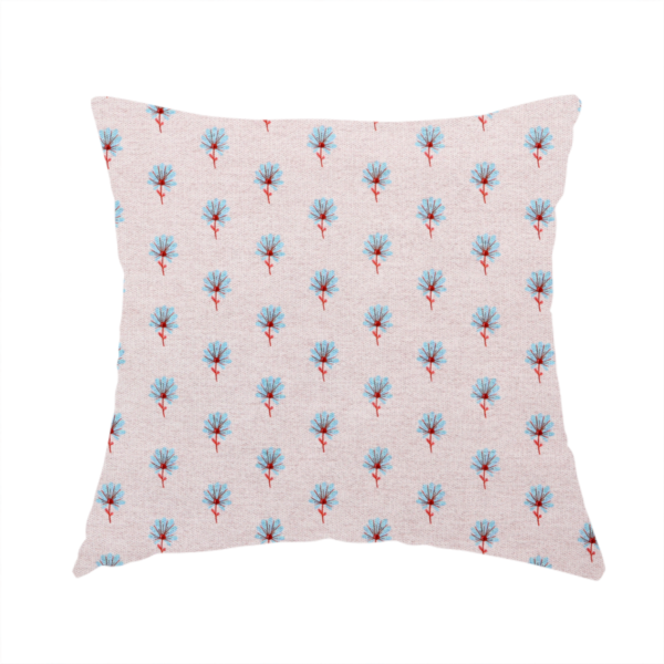 The fabric used to create this handmade cushion is a light pink textured canvas fabric featuring a dainty, minimalist ditsy floral print. The pattern consists of neat, repeating rows of tiny cornflower blue wildflowers with slender reddish-brown stems spread evenly across the soft pastel background.