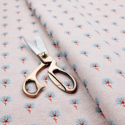 Light pink textured canvas fabric featuring a dainty, minimalist ditsy floral print. The pattern consists of neat, repeating rows of tiny cornflower blue wildflowers with slender reddish-brown stems spread evenly across the soft pastel background.