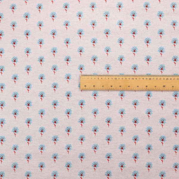Light pink textured canvas fabric featuring a dainty, minimalist ditsy floral print. The pattern consists of neat, repeating rows of tiny cornflower blue wildflowers with slender reddish-brown stems spread evenly across the soft pastel background.
