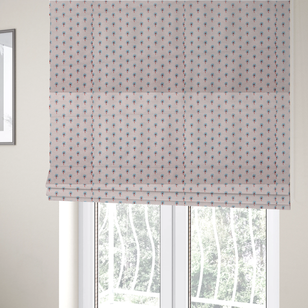 The fabric used to create these Roman blinds is a light pink textured canvas fabric featuring a dainty, minimalist ditsy floral print. The pattern consists of neat, repeating rows of tiny cornflower blue wildflowers with slender reddish-brown stems spread evenly across the soft pastel background.