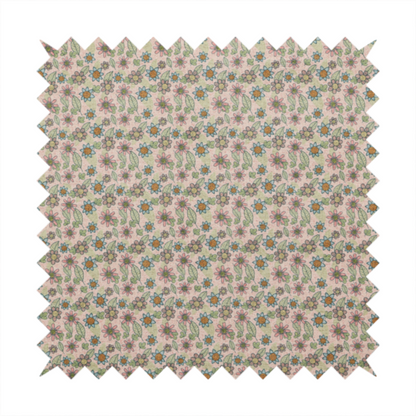 Textured dusty blush pink fabric with a dense retro calico print. The intricate pattern features small, sketch-style daisies with mustard yellow centres and blue-teal petals, mixed with pink blooms and delicate sage green leaves spread tightly across the surface.