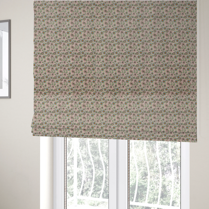 The fabric used to create these Roman blinds is a textured dusty blush pink fabric with a dense retro calico print. The intricate pattern features small, sketch-style daisies with mustard yellow centres and blue-teal petals, mixed with pink blooms and delicate sage green leaves spread tightly across the surface.