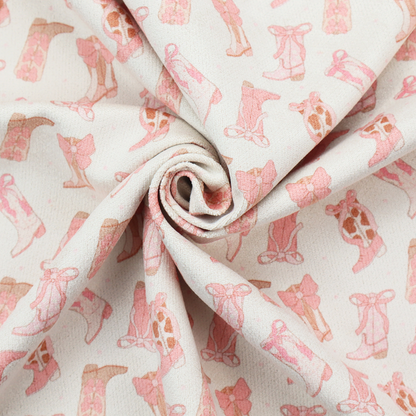 A repeating seamless pattern featuring an assortment of illustrated cowboy and cowgirl boots against a clean, off-white background. The boots are rendered in a soft, whimsical style with a colour palette consisting of various shades of pink, cream, light tan, and occasional brown accents.