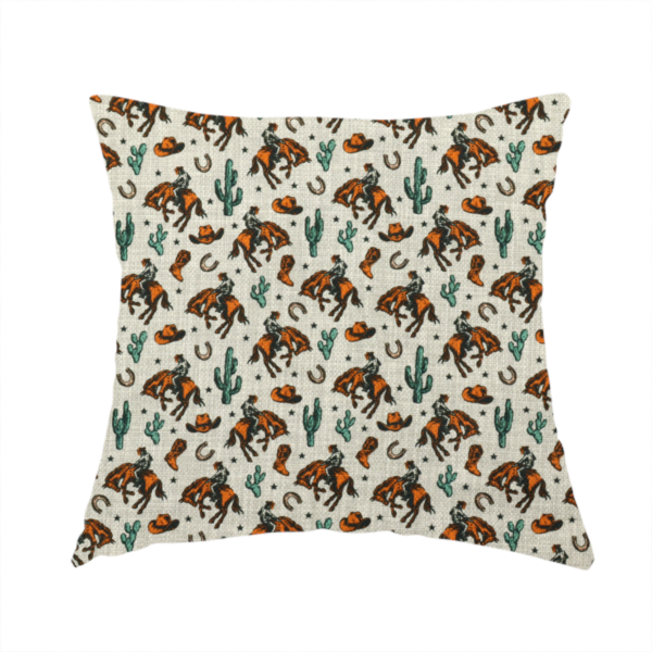 The fabric used to create this handmade cushion is a seamless, repeating pattern featuring traditional western motifs in a classic comic or illustration style, set against a textured, light oatmeal or linen-look background. The colour palette relies heavily on bold terracotta orange, deep teal green, and dark brown accents.