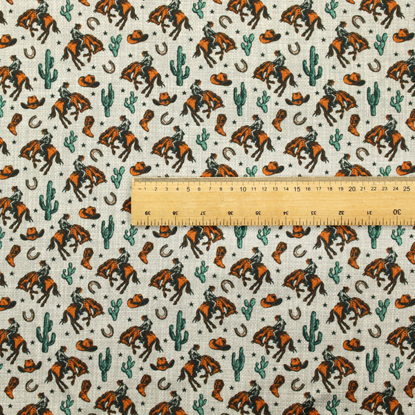 A seamless, repeating pattern featuring traditional western motifs in a classic comic or illustration style, set against a textured, light oatmeal or linen-look background. The colour palette relies heavily on bold terracotta orange, deep teal green, and dark brown accents.