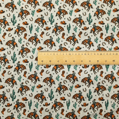 A seamless, repeating pattern featuring traditional western motifs in a classic comic or illustration style, set against a textured, light oatmeal or linen-look background. The colour palette relies heavily on bold terracotta orange, deep teal green, and dark brown accents.