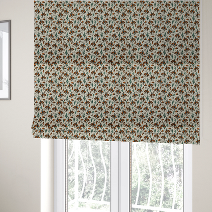 The fabric used to create these Roman blinds is a seamless, repeating pattern featuring traditional western motifs in a classic comic or illustration style, set against a textured, light oatmeal or linen-look background. The colour palette relies heavily on bold terracotta orange, deep teal green, and dark brown accents.