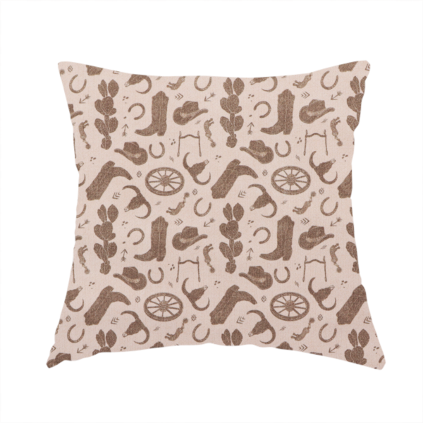 The fabric used to create this handmade cushion is a repeating toile-style western pattern featuring classic cowboy motifs printed in a monochromatic, textured medium-brown hue against a light beige background.