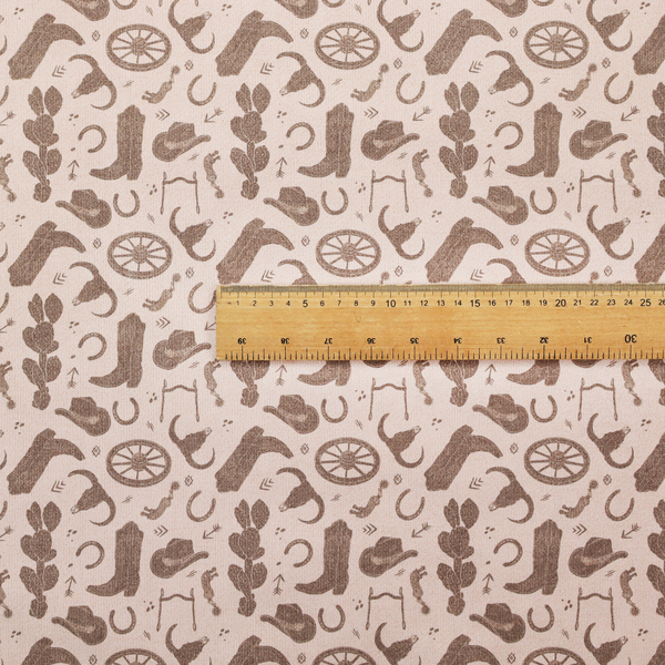 A repeating toile-style western pattern featuring classic cowboy motifs printed in a monochromatic, textured medium-brown hue against a light beige background.