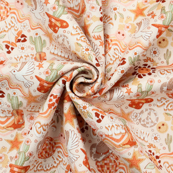 A vibrant, repeating pattern blending 1970s retro elements with a western aesthetic, set against a light cream-colored background. The design uses a warm colour palette of terracotta orange, muted mustard yellow, sage green, and soft tan.