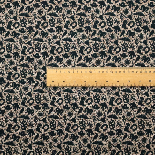A dense, repeating pattern featuring black graphic silhouettes of classic southwestern and western elements printed on a heavily textured, woven beige fabric base.
