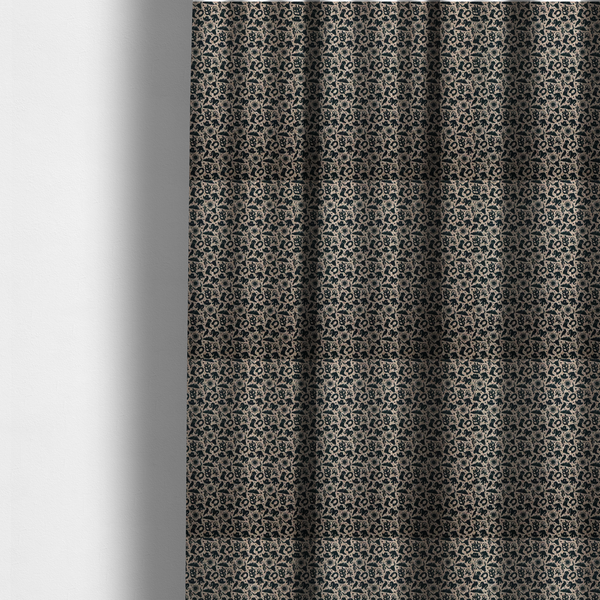 The fabric used to create these made-to-measure curtains is a dense, repeating pattern featuring black graphic silhouettes of classic southwestern and western elements printed on a heavily textured, woven beige fabric base.