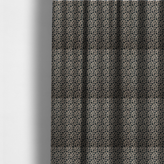 The fabric used to create these made-to-measure curtains is a dense, repeating pattern featuring black graphic silhouettes of classic southwestern and western elements printed on a heavily textured, woven beige fabric base.