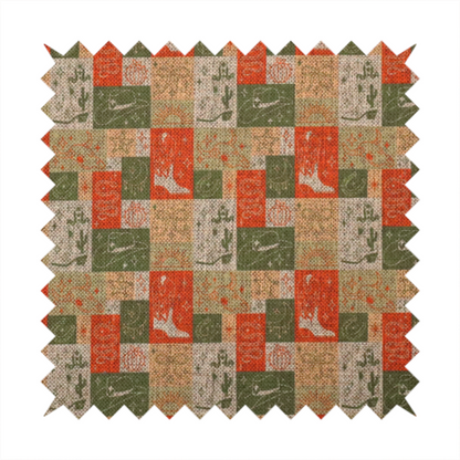 A repeating geometric patchwork pattern featuring western motifs framed inside distinct rectangular and square tiles. The design is printed on a heavily woven, textured linen-look fabric base. The Earth-toned colour palette consists of rich terracotta orange, olive green, muted sage, and warm cream.