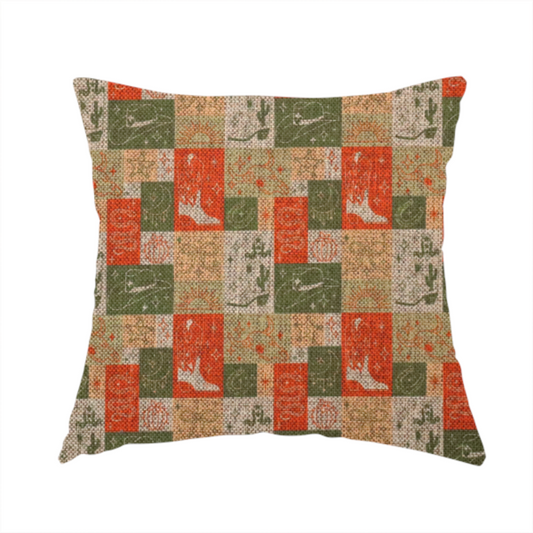 The fabric used to create this handmade cushion is a repeating geometric patchwork pattern featuring western motifs framed inside distinct rectangular and square tiles. The design is printed on a heavily woven, textured linen-look fabric base. The Earth-toned colour palette consists of rich terracotta orange, olive green, muted sage, and warm cream.
