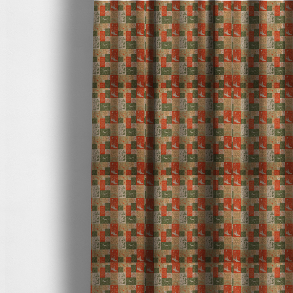 The fabric used to create these made-to-measure curtains is a repeating geometric patchwork pattern featuring western motifs framed inside distinct rectangular and square tiles. The design is printed on a heavily woven, textured linen-look fabric base. The Earth-toned colour palette consists of rich terracotta orange, olive green, muted sage, and warm cream.