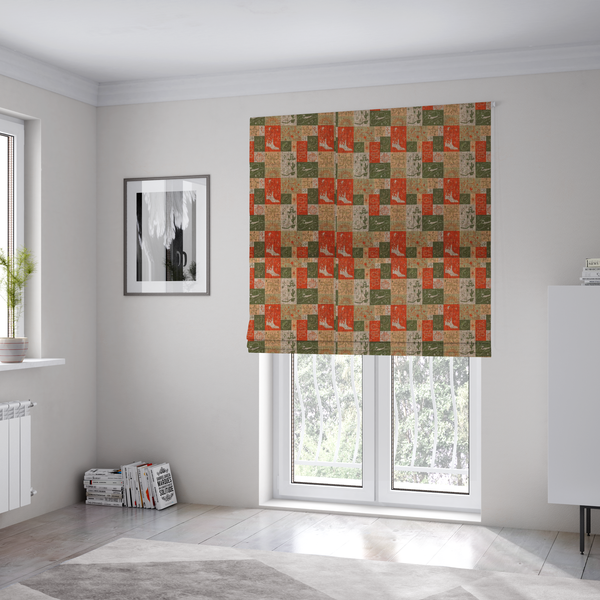 The fabric used to create these Roman blinds is a repeating geometric patchwork pattern featuring western motifs framed inside distinct rectangular and square tiles. The design is printed on a heavily woven, textured linen-look fabric base. The Earth-toned colour palette consists of rich terracotta orange, olive green, muted sage, and warm cream.