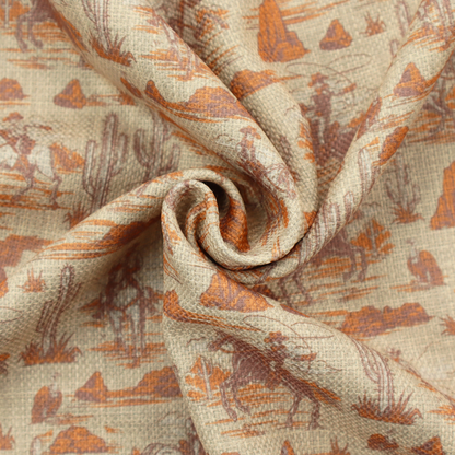 A repeating, scenic western toile pattern featuring detailed sketch-style illustrations over a heavily textured, linen-look light beige background. The monochrome design is rendered in warm tones of terracotta orange, rust, and dusty brown.
