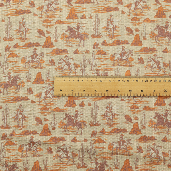 A repeating, scenic western toile pattern featuring detailed sketch-style illustrations over a heavily textured, linen-look light beige background. The monochrome design is rendered in warm tones of terracotta orange, rust, and dusty brown.