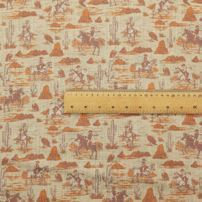 A repeating, scenic western toile pattern featuring detailed sketch-style illustrations over a heavily textured, linen-look light beige background. The monochrome design is rendered in warm tones of terracotta orange, rust, and dusty brown.