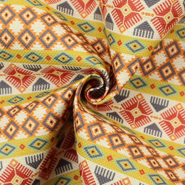 A vibrant, multi-coloured southwestern stripe pattern featuring repeating horizontal bands of geometric, tribal-inspired motifs. The detailed design is printed on a textured, linen-look cream fabric background, utilizing a bold colour palette of mustard yellow, terracotta red, slate blue-grey, and rust orange.