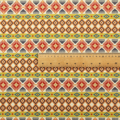 A vibrant, multi-coloured southwestern stripe pattern featuring repeating horizontal bands of geometric, tribal-inspired motifs. The detailed design is printed on a textured, linen-look cream fabric background, utilizing a bold colour palette of mustard yellow, terracotta red, slate blue-grey, and rust orange.
