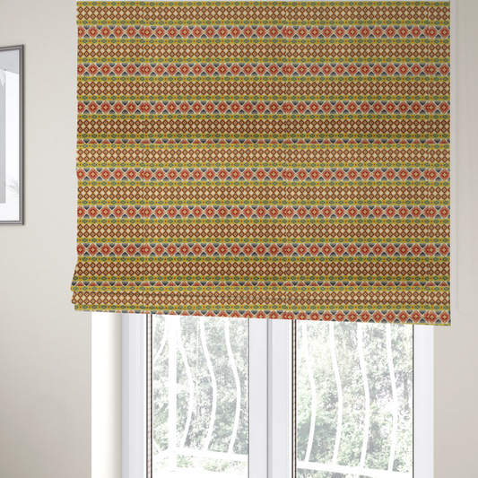 The fabric used to create these Roman blinds is a vibrant, multi-coloured southwestern stripe pattern featuring repeating horizontal bands of geometric, tribal-inspired motifs. The detailed design is printed on a textured, linen-look cream fabric background, utilizing a bold colour palette of mustard yellow, terracotta red, slate blue-grey, and rust orange.