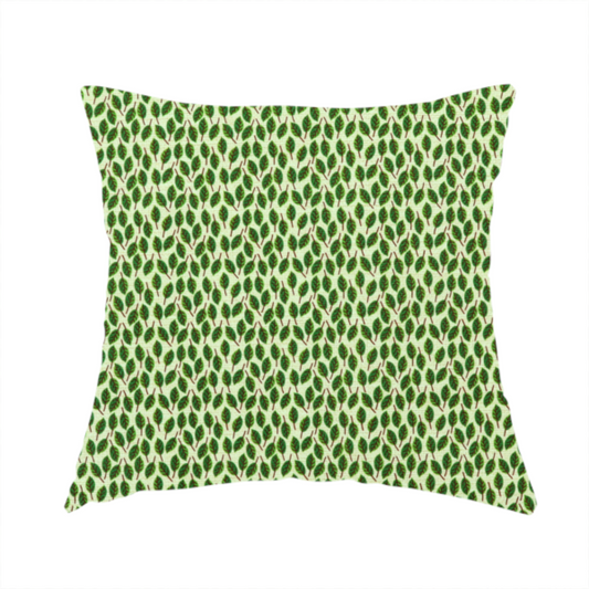 The fabric used to create this handmade cushion is a dense, small-scale pattern of miniature green leaves. The leaves are coloured dark green with subtle brown stems, arranged closely together in neat diagonal columns across a pale, light green background with a visible fine-woven texture.