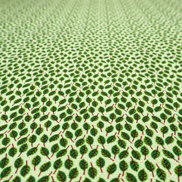 A dense, small-scale pattern of miniature green leaves. The leaves are coloured dark green with subtle brown stems, arranged closely together in neat diagonal columns across a pale, light green background with a visible fine-woven texture.