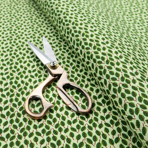 A dense, small-scale pattern of miniature green leaves. The leaves are coloured dark green with subtle brown stems, arranged closely together in neat diagonal columns across a pale, light green background with a visible fine-woven texture.