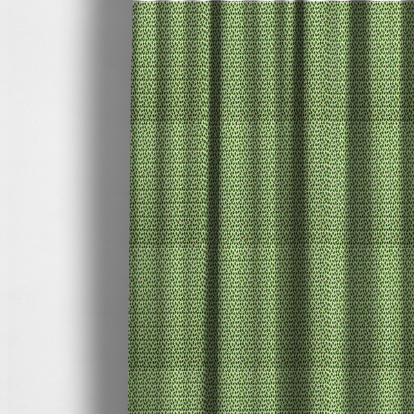 The fabric used to create these made-to-measure curtains is a dense, small-scale pattern of miniature green leaves. The leaves are coloured dark green with subtle brown stems, arranged closely together in neat diagonal columns across a pale, light green background with a visible fine-woven texture.