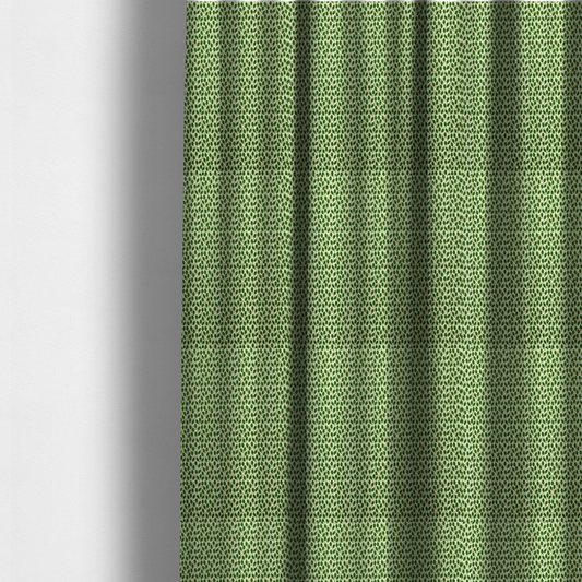 The fabric used to create these made-to-measure curtains is a dense, small-scale pattern of miniature green leaves. The leaves are coloured dark green with subtle brown stems, arranged closely together in neat diagonal columns across a pale, light green background with a visible fine-woven texture.