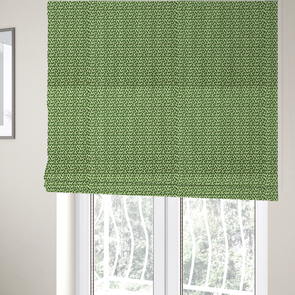 The fabric used to create these Roman blinds is a dense, small-scale pattern of miniature green leaves. The leaves are coloured dark green with subtle brown stems, arranged closely together in neat diagonal columns across a pale, light green background with a visible fine-woven texture.
