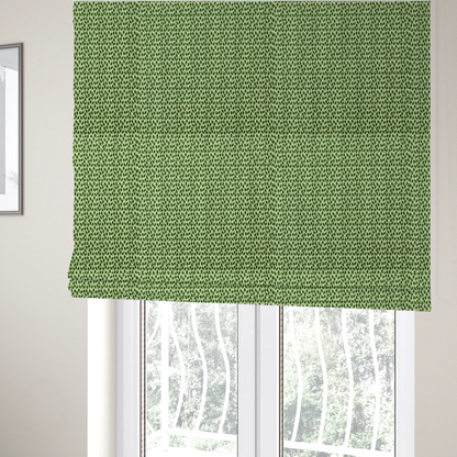 The fabric used to create these Roman blinds is a dense, small-scale pattern of miniature green leaves. The leaves are coloured dark green with subtle brown stems, arranged closely together in neat diagonal columns across a pale, light green background with a visible fine-woven texture.
