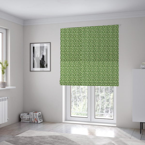 The fabric used to create these Roman blinds is a dense, small-scale pattern of miniature green leaves. The leaves are coloured dark green with subtle brown stems, arranged closely together in neat diagonal columns across a pale, light green background with a visible fine-woven texture.